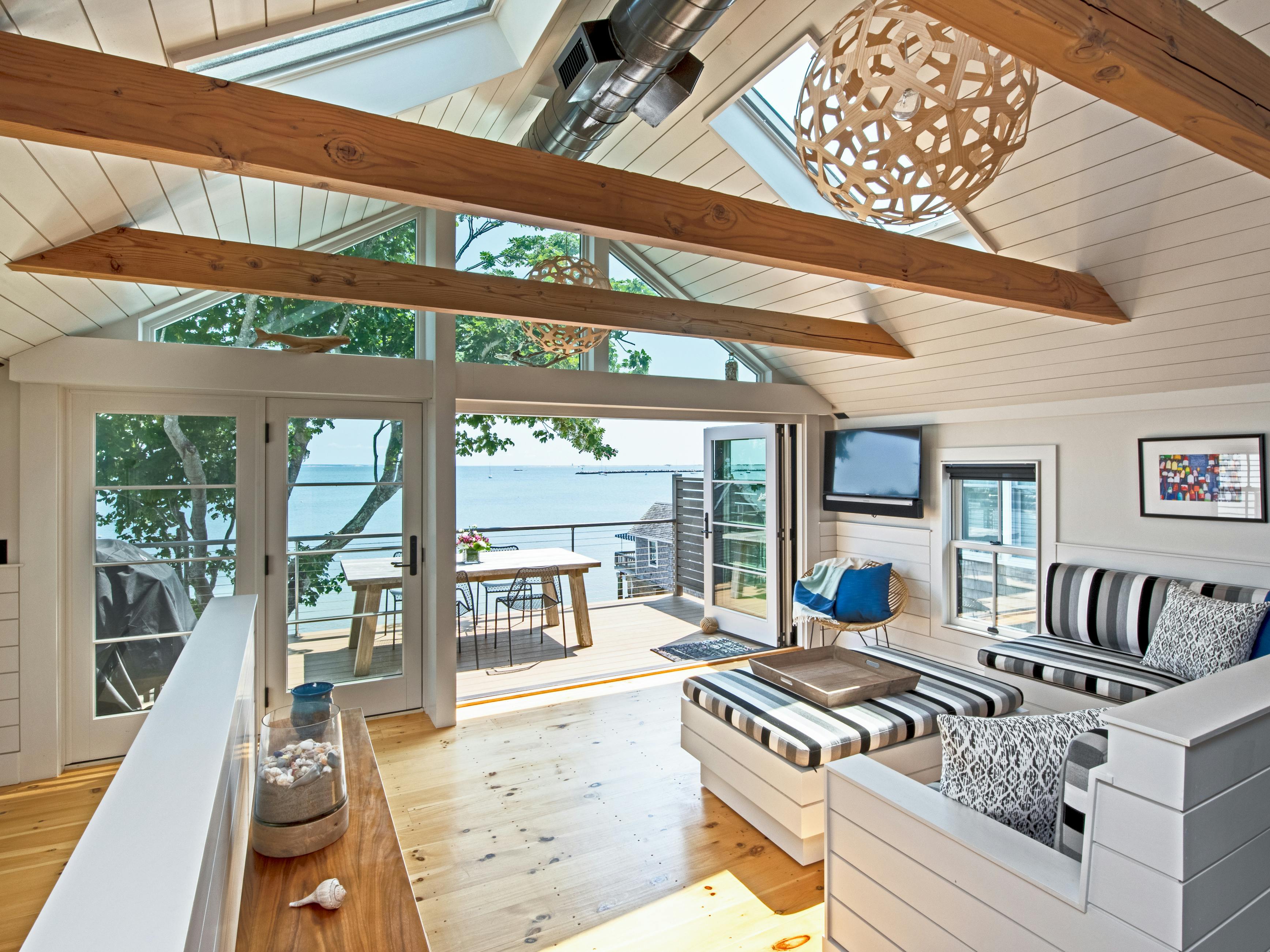 The exterior of a vacation rental with charming design overlooking the ocean.